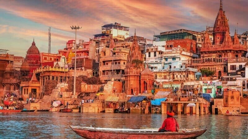 A mesmerizing view of the Ganges River and the ghats in Varanasi, India, during sunrise.